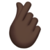 Hand With Index Finger And Thumb Crossed: Dark Skin Tone Emoji Copy Paste ― 🫰🏿 - apple
