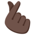 Hand With Index Finger And Thumb Crossed: Dark Skin Tone Emoji Copy Paste ― 🫰🏿 - google-android