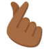 Hand With Index Finger And Thumb Crossed: Medium-dark Skin Tone Emoji Copy Paste ― 🫰🏾 - google-android
